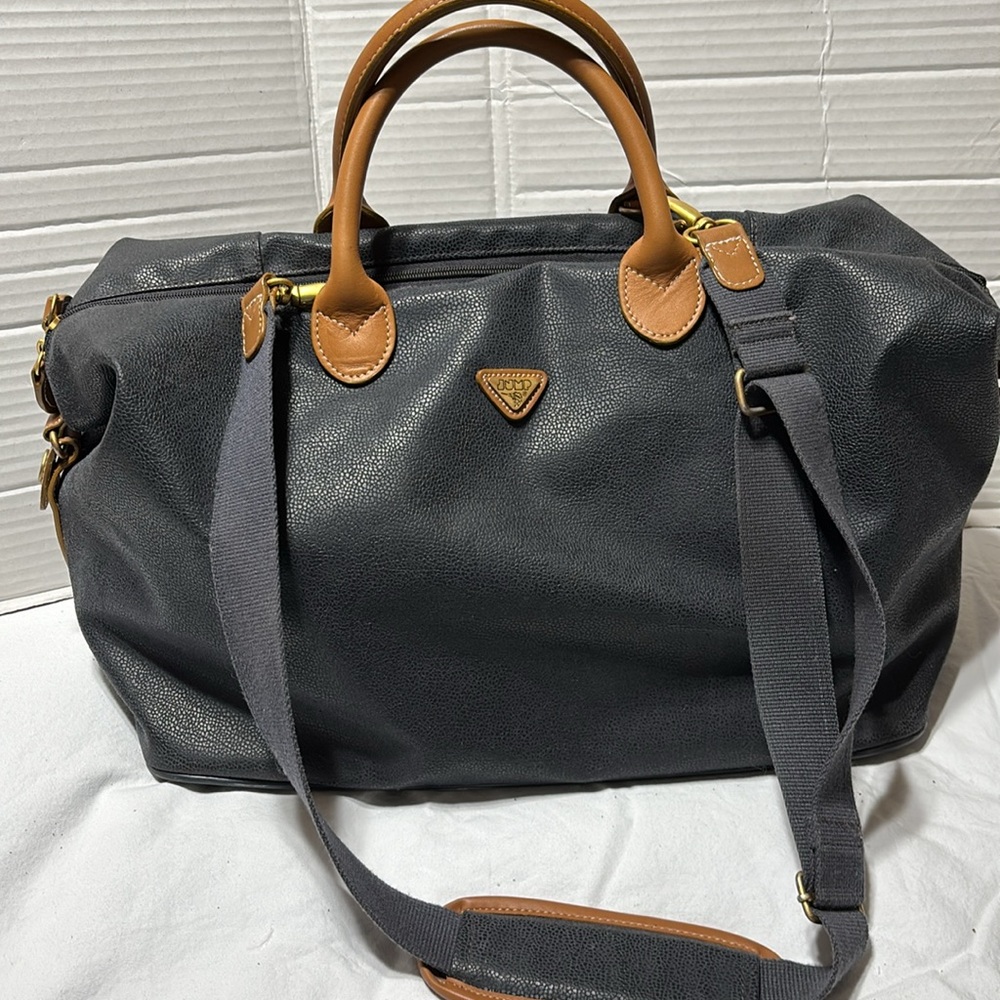 Jump overnight bag with leather trim and double straps. EUC